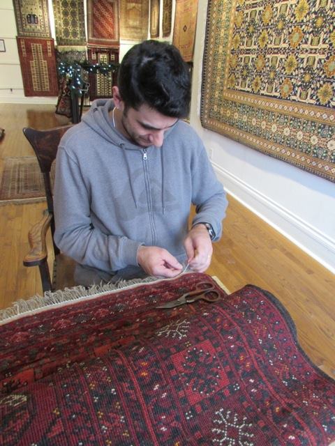 A man repairing the carpet